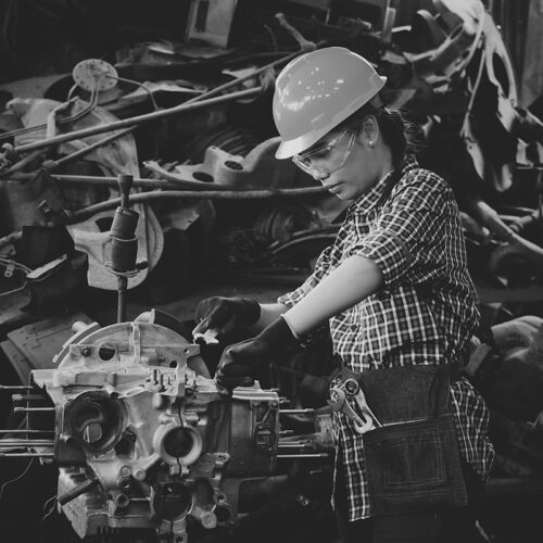 Staffing manufacturing temp worker assembling a car engine